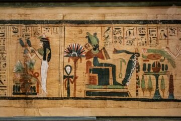 Ancient Khemetic papyrus with figures and hieroglyphic text, representing manuscript study; not held by the Khemetic Aboriginal Library