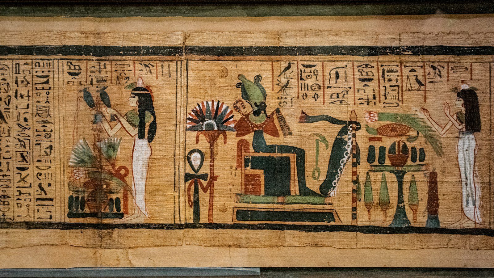Ancient Khemetic papyrus with figures and hieroglyphic text, representing manuscript study; not held by the Khemetic Aboriginal Library