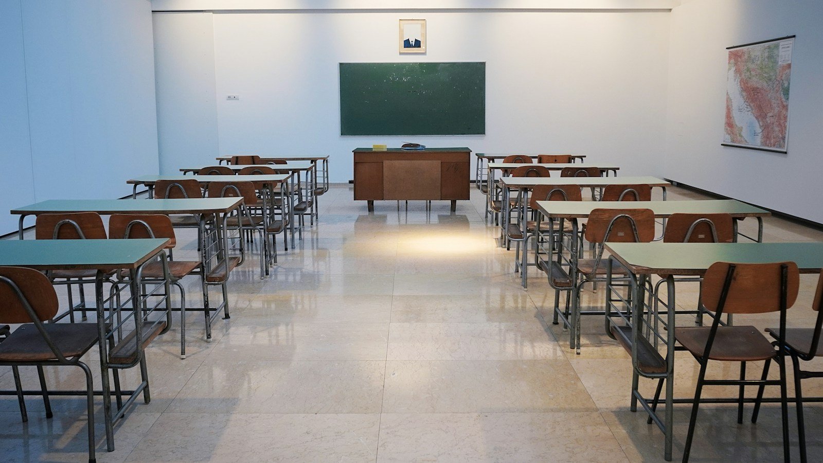 Empty classroom with rows of desks; illustrative stock photograph, not an SFUSD campus.