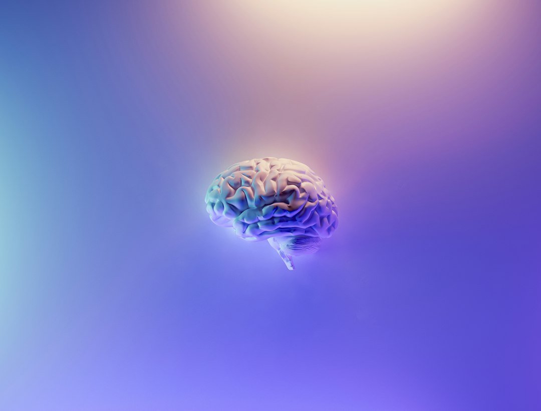 Artistic illustration of a human brain in luminous blue and purple tones