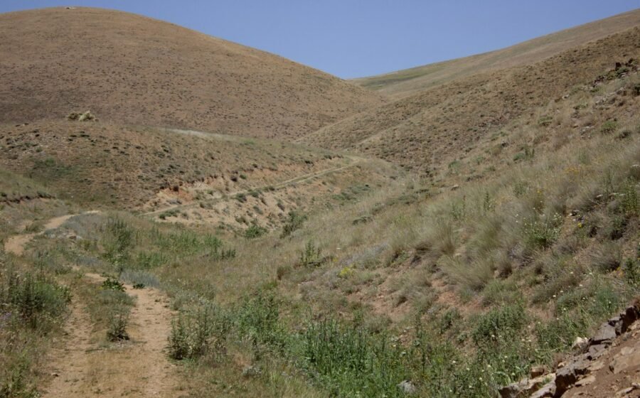 Dry hills with sparse vegetation illustrating California wildfire risk; not live conditions in Santa Monica Mountains