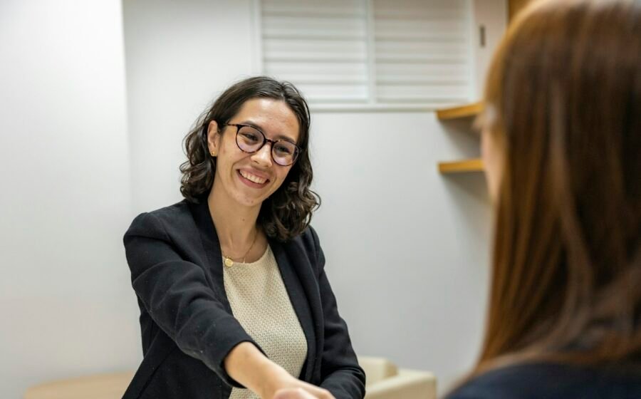 Illustrative job interview handshake, accompanying ManpowerGroup earnings report; not employees of ManpowerGroup