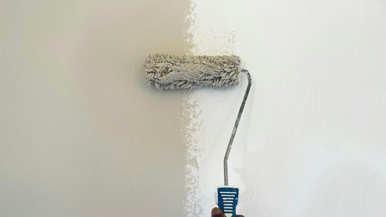 Home wall being painted; illustrates public-health prevention discussion, no indication that this paint contains lead