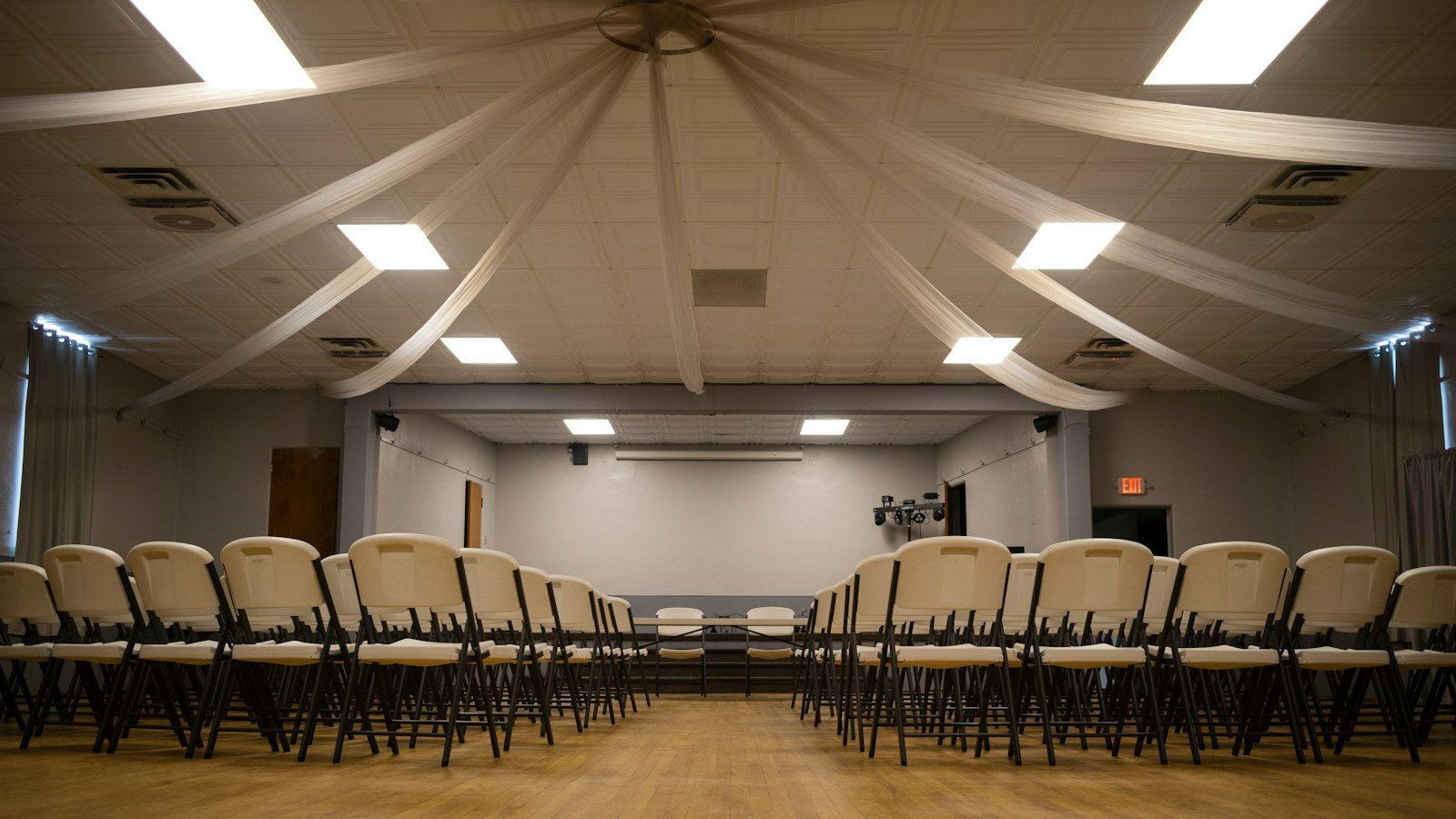 Chairs arranged in an event meeting room; illustrative, not a Khemetic Nation meeting