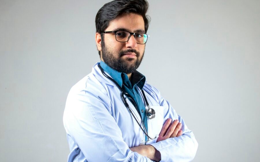 Healthcare worker wearing stethoscope; illustrative photo, not WHO–INTERPOL signing
