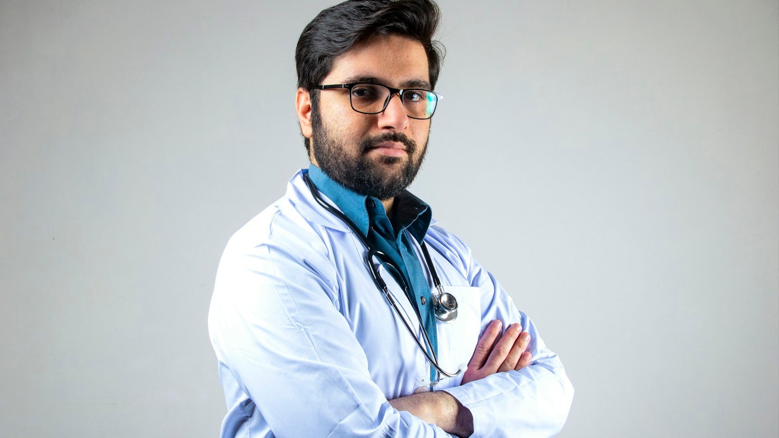 Healthcare worker wearing stethoscope; illustrative photo, not WHO–INTERPOL signing