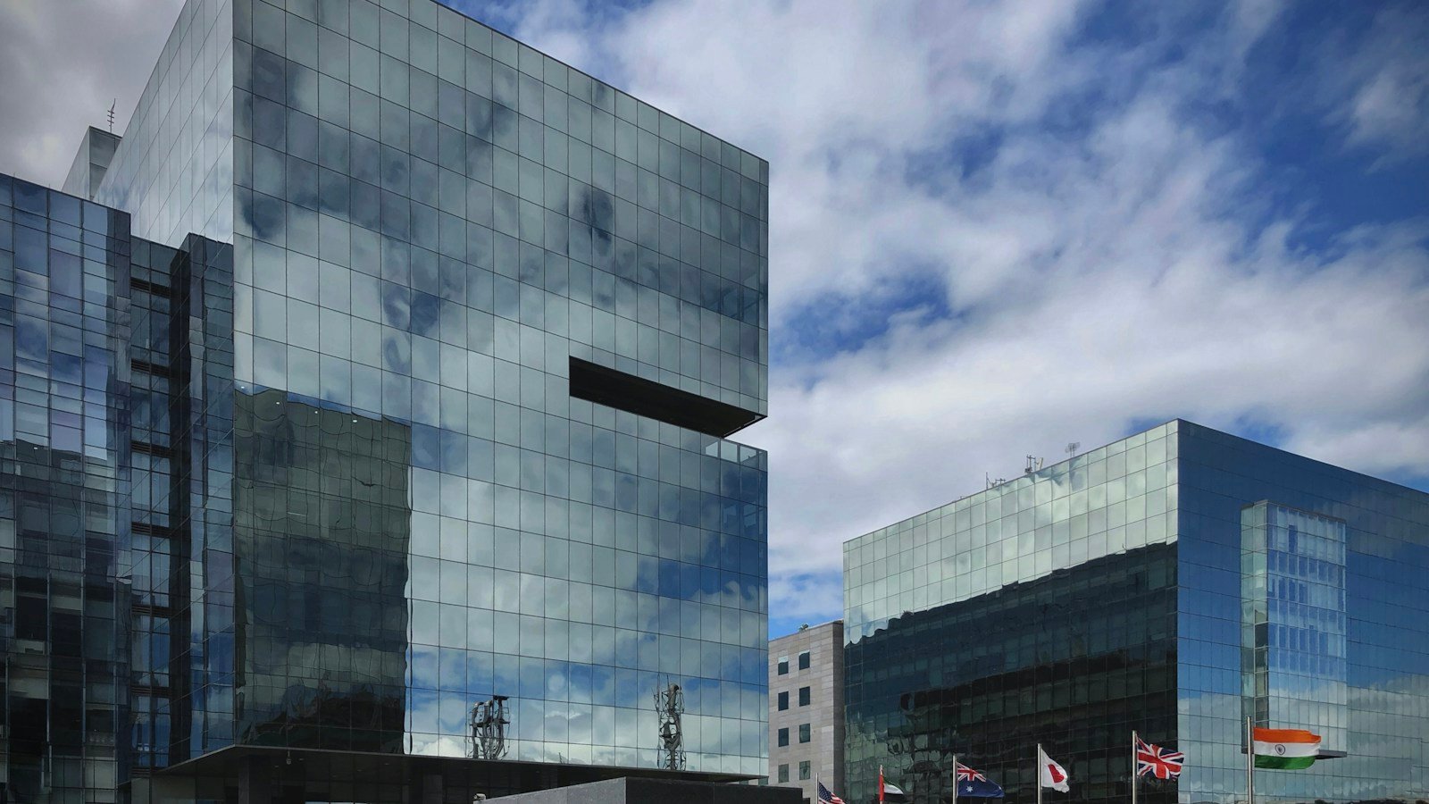 Modern office tower photographed from below; illustrative photograph, not a Wipro property.