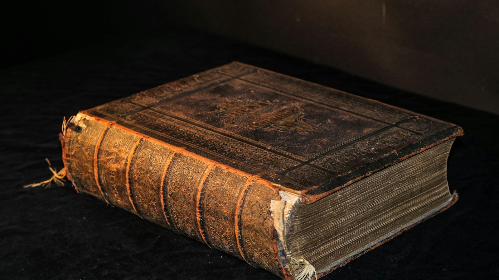 A bound book on a table, illustrating preservation of written records