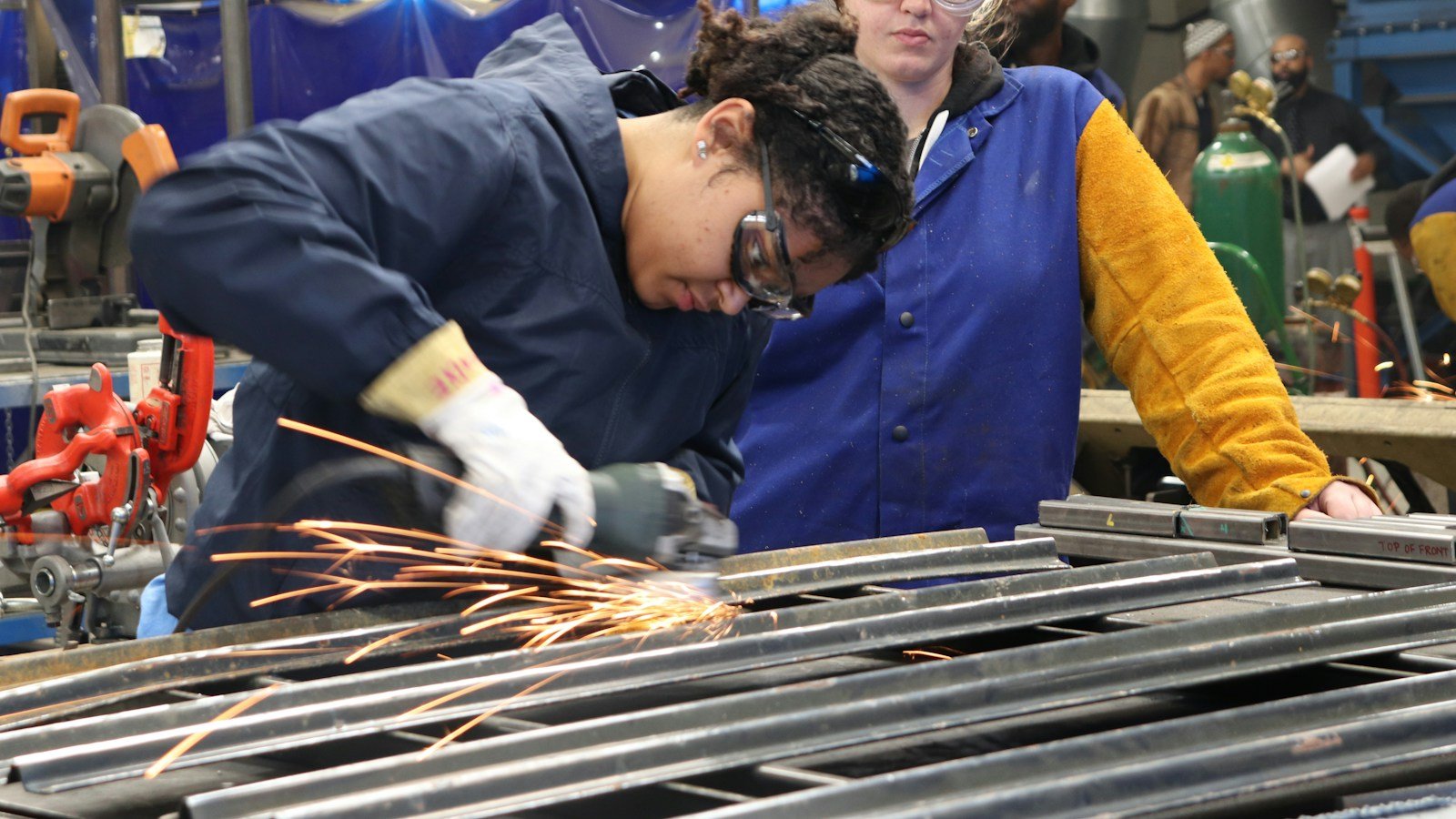Illustrative vocational training workshop with people developing practical job skills